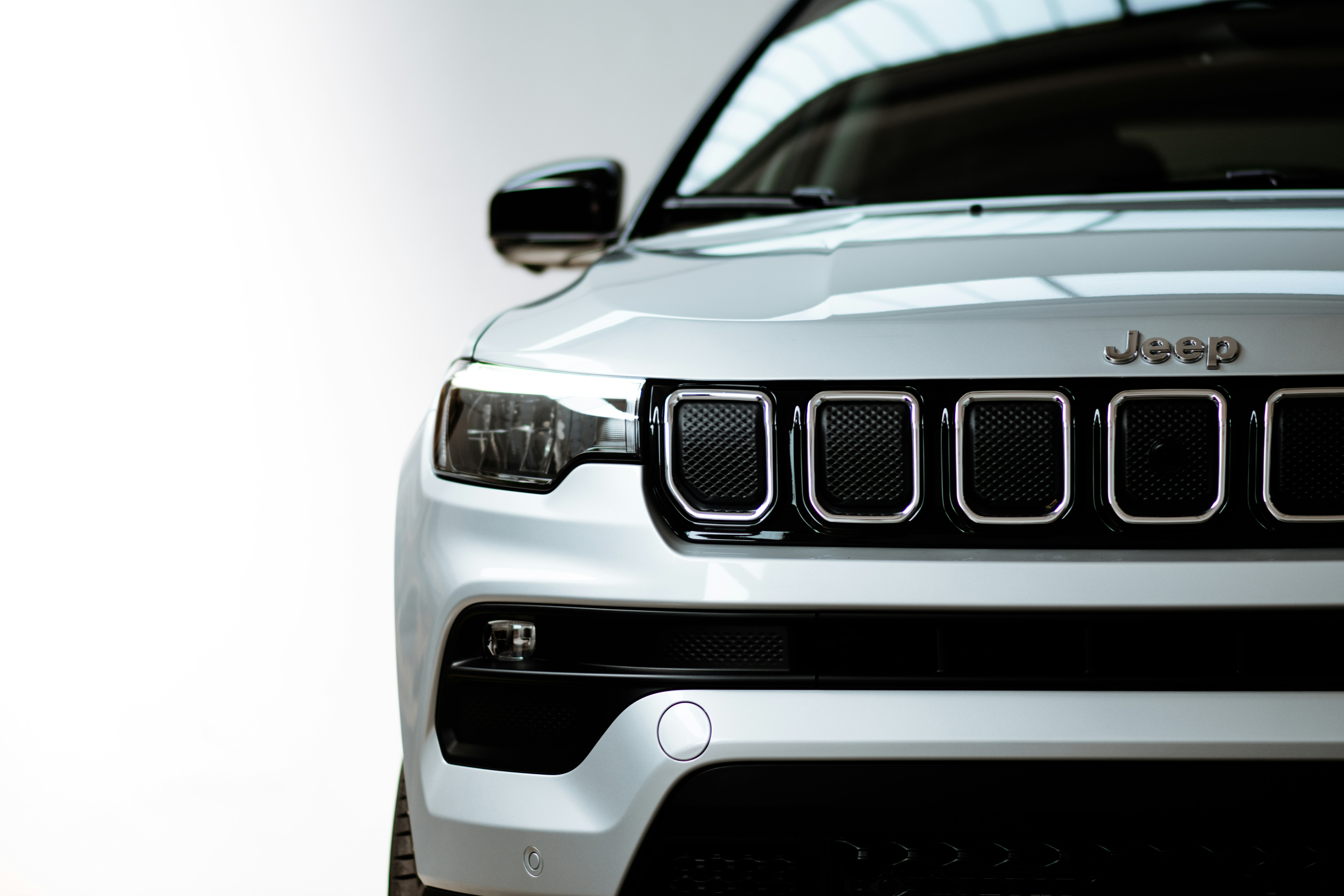 white and black car in close up photography